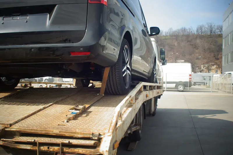 car towed in a grocery store lot