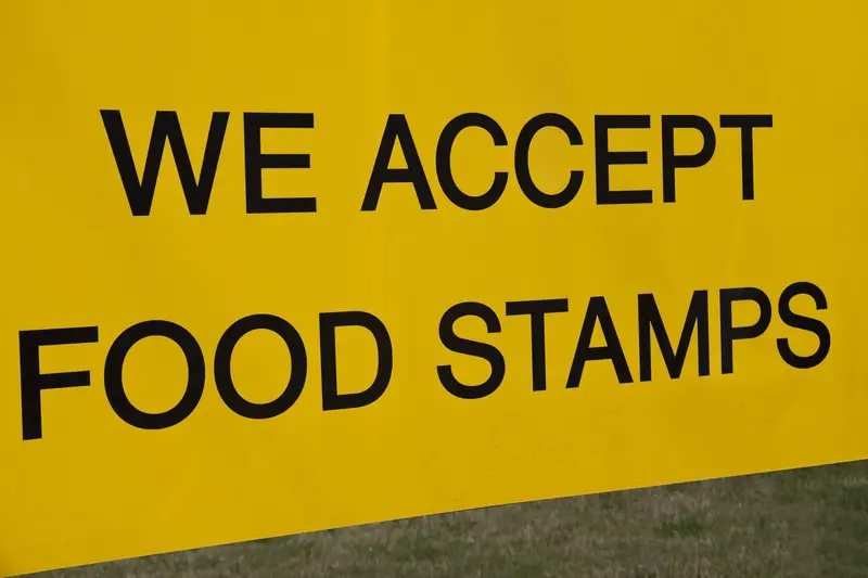 We accept food stamps sign seen in the front of the store