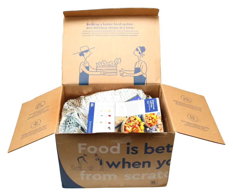 Open box of meal prep ingredients in cooler bag - Blue Apron 